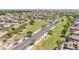 Aerial view of a well-maintained neighborhood with lush green spaces and a park at 16917 W Sonora St, Goodyear, AZ 85338
