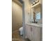 Bathroom vanity with stone countertop, modern faucet and light fixture plus a separate toilet room at 1718 W Colter St # 142, Phoenix, AZ 85015