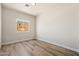 Empty bedroom with wood-look floors, neutral walls and natural light at 1718 W Colter St # 142, Phoenix, AZ 85015