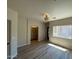 Bright bedroom with wood-look tile flooring and a modern light fixture at 1718 W Colter St # 142, Phoenix, AZ 85015