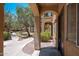Charming condo exterior featuring stucco walls, arched entryways, and lovely desert landscaping at 1718 W Colter St # 142, Phoenix, AZ 85015
