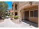 Charming condo exterior showcasing stucco walls, arched entryways, and lovely desert landscaping at 1718 W Colter St # 142, Phoenix, AZ 85015