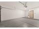 Spacious garage with painted floor and an automatic door opener at 1718 W Colter St # 142, Phoenix, AZ 85015