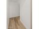 Small hallway with wood floors and white walls that leads to other parts of the house at 1718 W Colter St # 142, Phoenix, AZ 85015