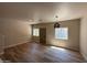 Bright living room with wood-look tile flooring and a view of the exterior at 1718 W Colter St # 142, Phoenix, AZ 85015