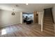 Open-concept living room with stairs, tiled floor, and a view of the kitchen at 1718 W Colter St # 142, Phoenix, AZ 85015