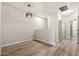Upstairs loft with wood floors, neutral paint, contemporary light fixture, and view of hallway at 1718 W Colter St # 142, Phoenix, AZ 85015