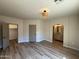 Main bedroom featuring wood-look tile flooring and an ensuite bathroom at 1718 W Colter St # 142, Phoenix, AZ 85015