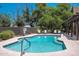 Inviting community pool with lounge chairs and mature landscaping at 1718 W Colter St # 142, Phoenix, AZ 85015