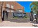 Community sign and landscaping, showing the residential address at 1718 W Colter St # 142, Phoenix, AZ 85015