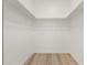 Walk-in closet with shelving, a rod for hanging clothes, and wood-look floors at 1718 W Colter St # 142, Phoenix, AZ 85015