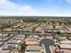 Expansive aerial view of a residential neighborhood featuring well-maintained homes and streets at 18066 W Weatherby Dr, Surprise, AZ 85374