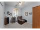 A comfortable room with a fan, window blinds, and a brown recliner chair on neutral colored carpet at 18066 W Weatherby Dr, Surprise, AZ 85374