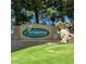 Elegant community sign that reads Arizona Traditions near a waterfall feature and manicured lawn at 18066 W Weatherby Dr, Surprise, AZ 85374