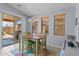 Bright dining area with a sliding glass door, natural light, and stylish tile flooring at 18066 W Weatherby Dr, Surprise, AZ 85374