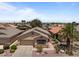 Charming single-Gathering home featuring a neutral color palette, well-manicured front yard, and an attached two-car garage at 18066 W Weatherby Dr, Surprise, AZ 85374