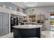 Well-equipped kitchen with stainless steel appliances, a spacious island, and plenty of counter space for meal preparation at 18066 W Weatherby Dr, Surprise, AZ 85374