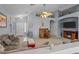 Open living area with neutral tones, ceiling fan, and archways create a welcoming space at 18066 W Weatherby Dr, Surprise, AZ 85374