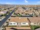 Aerial view of home in community featuring a backyard with a patio, seating area, turf grass, and a privacy fence at 19428 S 210Th Pl, Queen Creek, AZ 85142