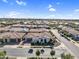 Aerial view of single-story home with tile roof in a community with manicured landscaping and neutral-toned exterior paint at 19428 S 210Th Pl, Queen Creek, AZ 85142