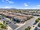 Aerial view of a single-story home with a tile roof in a community with manicured landscaping and neutral-toned exteriors at 19428 S 210Th Pl, Queen Creek, AZ 85142