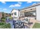 Backyard patio with comfortable seating around a fire pit, perfect for outdoor gatherings at 19428 S 210Th Pl, Queen Creek, AZ 85142