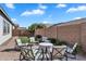 Backyard with turf, desert landscaping and a seating area around a fire pit at 19428 S 210Th Pl, Queen Creek, AZ 85142