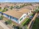Aerial view of the backyard with seating area, patio, turf grass, and privacy fence at 19428 S 210Th Pl, Queen Creek, AZ 85142