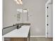 A bathroom with double mirrors, a stylish countertop, and modern fixtures at 19428 S 210Th Pl, Queen Creek, AZ 85142