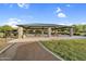 Community picnic shelter with picnic tables and barbeque grills surrounded by a landscaped park at 19428 S 210Th Pl, Queen Creek, AZ 85142