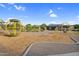 Community park featuring a picnic shelter, swings, and playground surrounded by a landscaped park at 19428 S 210Th Pl, Queen Creek, AZ 85142