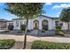 Inviting single-story home with desert landscaping and a brick pathway leading to the front door at 19428 S 210Th Pl, Queen Creek, AZ 85142