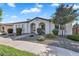 Charming single-story home with dual arched entryway and desert landscaping at 19428 S 210Th Pl, Queen Creek, AZ 85142