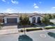 Beautiful single-story home with a two-car garage, tile roof, manicured landscaping, and neutral-toned exterior paint at 19428 S 210Th Pl, Queen Creek, AZ 85142