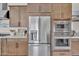 Close-up of the kitchen highlighting stainless steel appliances, granite countertops, and ample cabinetry at 19428 S 210Th Pl, Queen Creek, AZ 85142