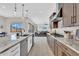 Well-equipped kitchen with granite countertops, stainless appliances, and seamless flow to the living area at 19428 S 210Th Pl, Queen Creek, AZ 85142
