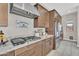 Gourmet kitchen featuring granite countertops, a stainless steel range hood, and modern appliances at 19428 S 210Th Pl, Queen Creek, AZ 85142