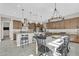 Open-concept kitchen and dining area featuring modern finishes and ample seating at 19428 S 210Th Pl, Queen Creek, AZ 85142
