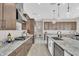 Spacious kitchen with granite countertops, stainless steel appliances, and pendant lighting at 19428 S 210Th Pl, Queen Creek, AZ 85142