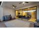Covered patio with ceiling fans and sliding glass doors leading to the interior living space at 19428 S 210Th Pl, Queen Creek, AZ 85142