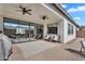 Covered patio with comfortable seating, perfect for enjoying the backyard view at 19428 S 210Th Pl, Queen Creek, AZ 85142