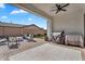 Covered patio featuring a ceiling fan, an outdoor grill and a cozy seating area, ideal for outdoor dining at 19428 S 210Th Pl, Queen Creek, AZ 85142