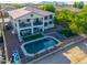 Aerial view of the backyard with a pool, balcony, outdoor seating, and landscaping at 20139 N Bustos Way, Maricopa, AZ 85138