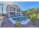 Resort-style backyard with a pool, covered patio, and well-maintained landscaping at 20139 N Bustos Way, Maricopa, AZ 85138