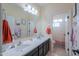 Bathroom showcasing a double sink vanity and neutral decor at 20139 N Bustos Way, Maricopa, AZ 85138