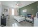 Charming bedroom featuring a white bed frame, and coordinated decor at 20139 N Bustos Way, Maricopa, AZ 85138
