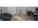 Bedroom featuring hardwood floors, office desk, chair, and reading chair at 20139 N Bustos Way, Maricopa, AZ 85138