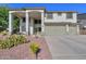 The exterior of this house is complete with desert landscaping and a spacious three-car garage at 20139 N Bustos Way, Maricopa, AZ 85138