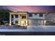 Two-story home boasts a three-car garage and grand entrance with elegant architectural details at 20139 N Bustos Way, Maricopa, AZ 85138