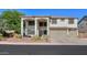 Charming two-story home featuring stucco siding, a tile roof, and a desert landscaped yard at 20139 N Bustos Way, Maricopa, AZ 85138